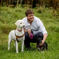 Freedom Project advocate Luke with two dogs