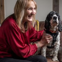 Freedom project foster volunteer Chrissie with a spaniel