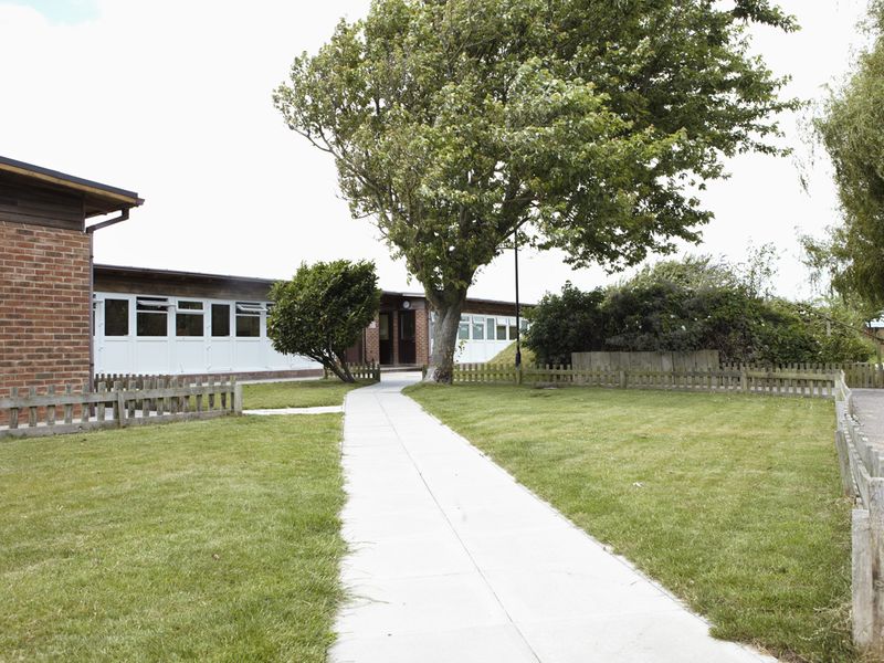 Shoreham Rehoming Centre exterior building of the kennels outside down a white path.