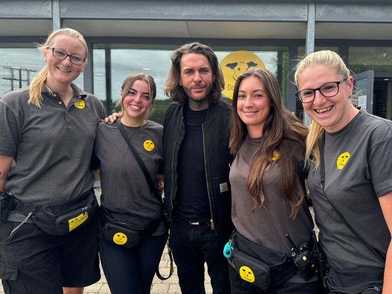 pete wicks taking a picture with four ladies from Basildon rehoming centre team