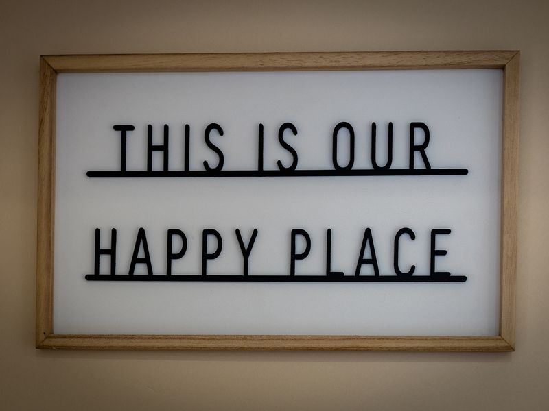 A sign at Dogs Trust Oakfield Oldies that reads: This is our happy place.